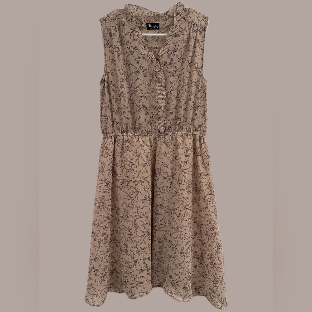 Women’s beige dress with ruffle and black floral